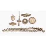 A collection of seven Victorian/Edwardian jewellery items to include a silver Albert chain,