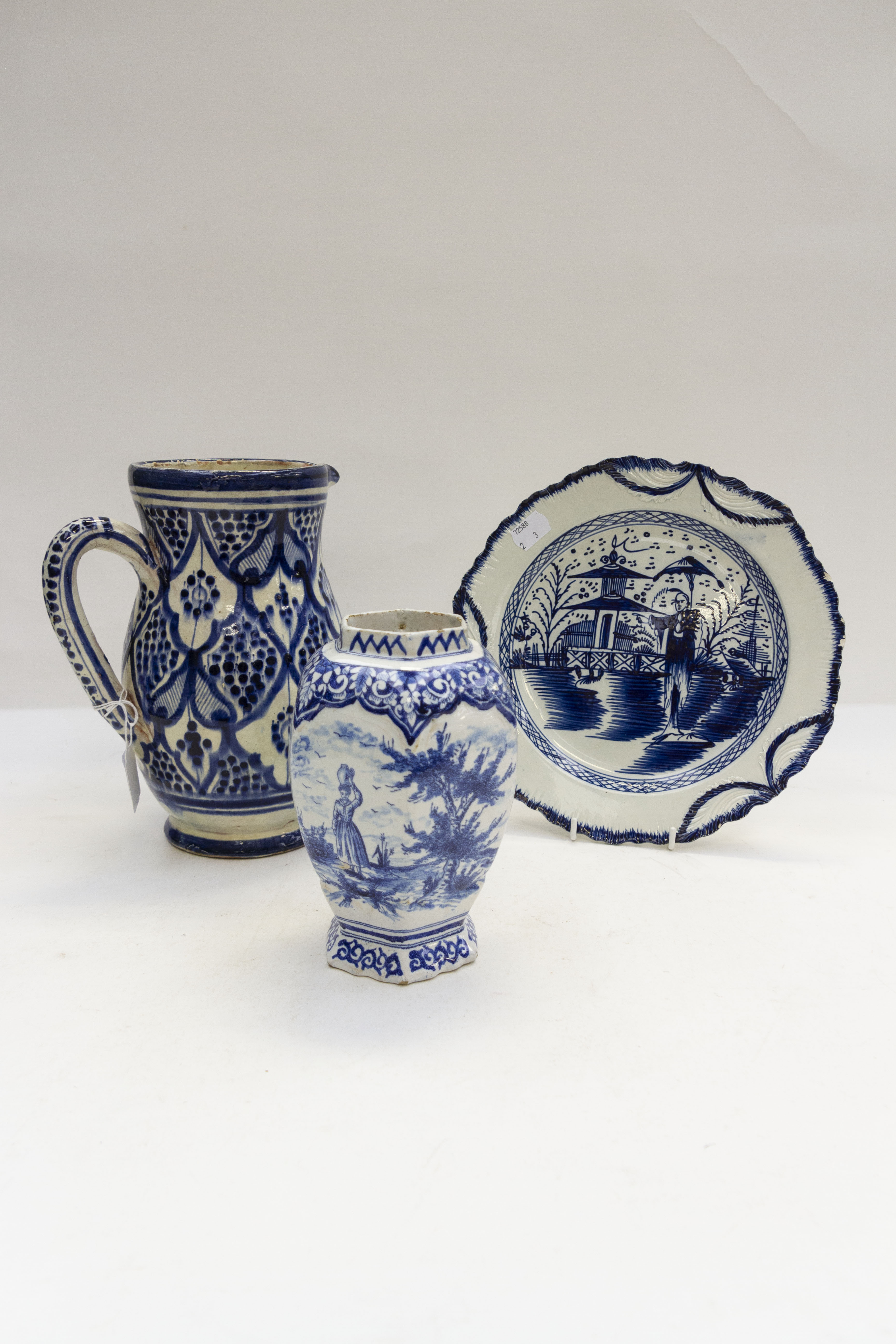 A collection of Delftware including 18th Century style polychrome plate decorated with Chinese