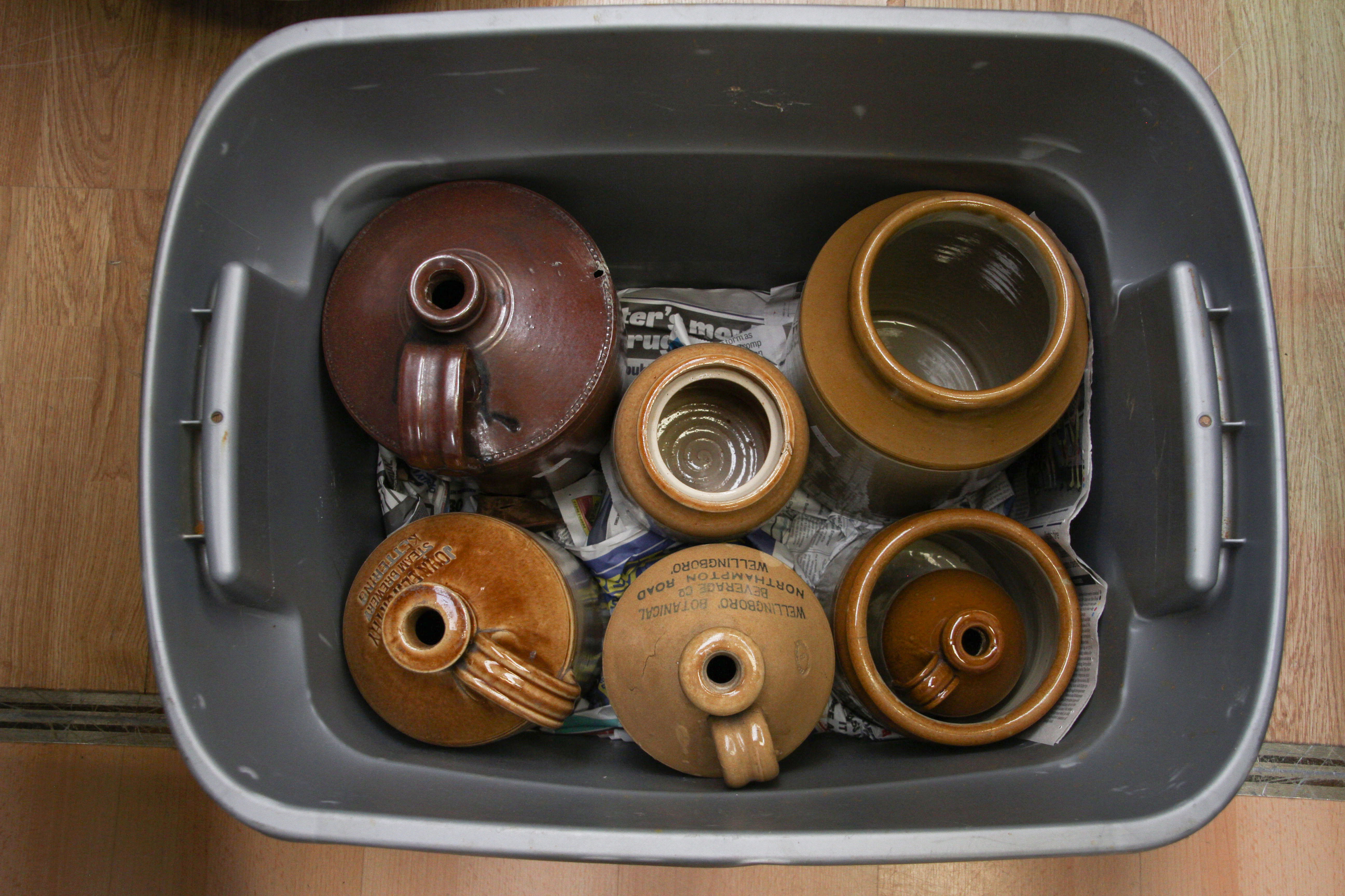 Four earthenware part glazed jugs,