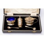 Birmingham silver cruet set including salt bowl, pepper pot and mustard pot, two spoons in box, 2.