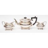 A George V silver teapot, sugar bowl and milk jug, Sheffield 1917 by Stevenson and Law,