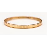 A rose gold bangle, stamped 15ct, internal diameter approx 70 mm, weight approx 16.