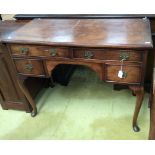 A Queen Anne style walnut dressing table, fitted with two long and two short drawers,