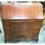 A George III style walnut veneered bureau,