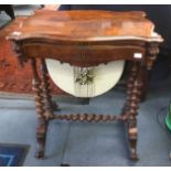 A mid Victorian walnut serpentine fronted ladies work table,