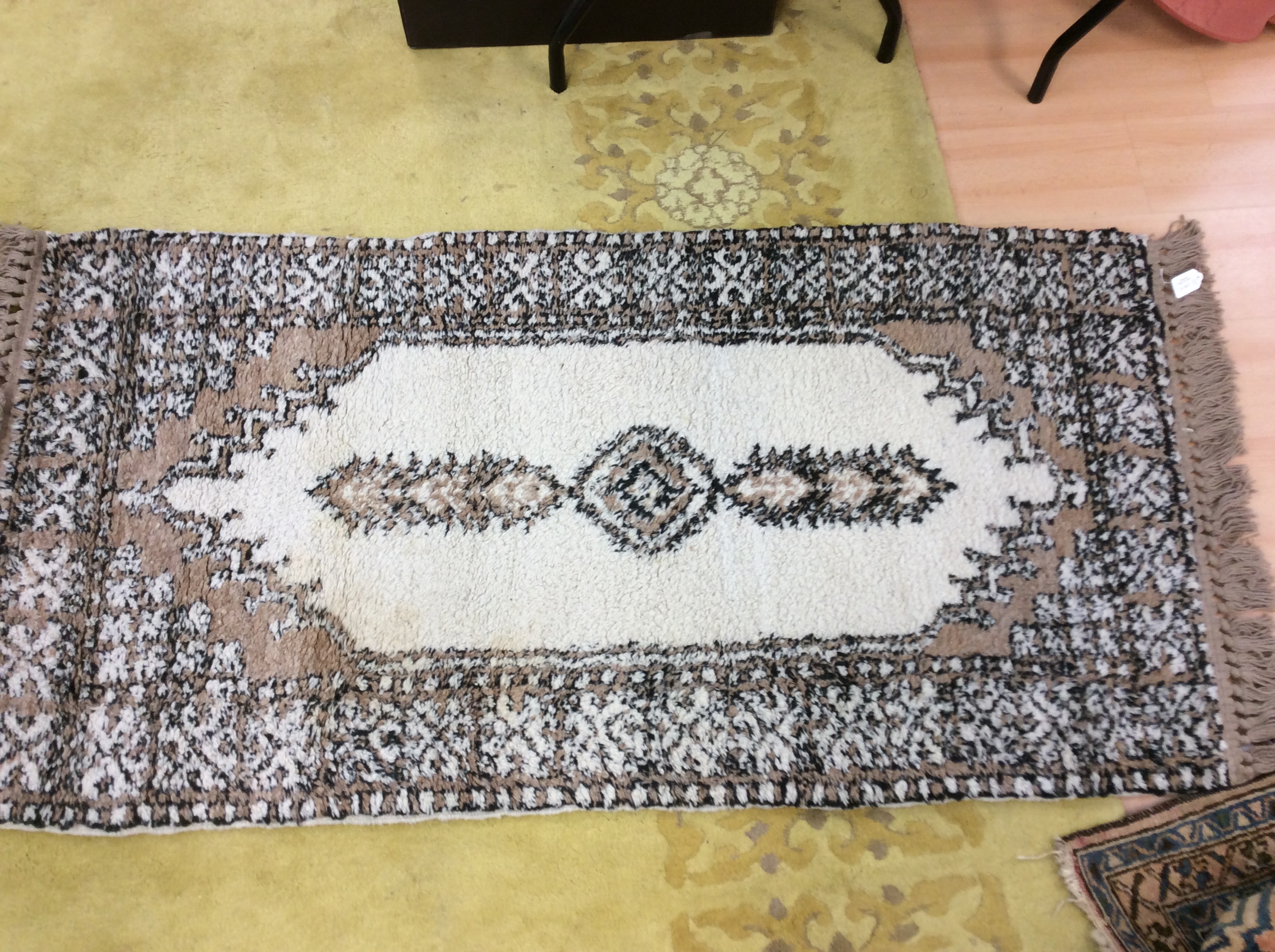 A collection of various woollen rugs, including one possibly Persian,