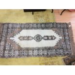 A collection of various woollen rugs, including one possibly Persian,