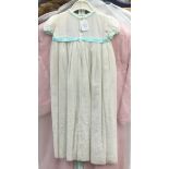 A child's Christening gown with turquoise ribbon mid 20th Century