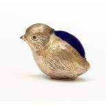 A George V silver mounted novelty pin cushion in the form of a chick, Adie & Lovekin Ltd,