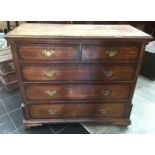 A George III chest of drawers , two short over three long drawers.