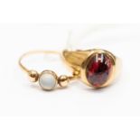 A 9ct gold and moonstone ring, size Q, along with a garnet (A/F) and 9ct gold ring, size N,