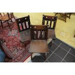 A set of three 19th Century oak Gothic Revival chairs,