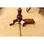 An early Victorian walnut music stand, adjustable stand,