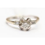 Diamond solitaire 18 ct gold ring with diamond set shoulders