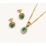An emerald and white stone oval cluster pendant and matching earring set, 9ct gold,