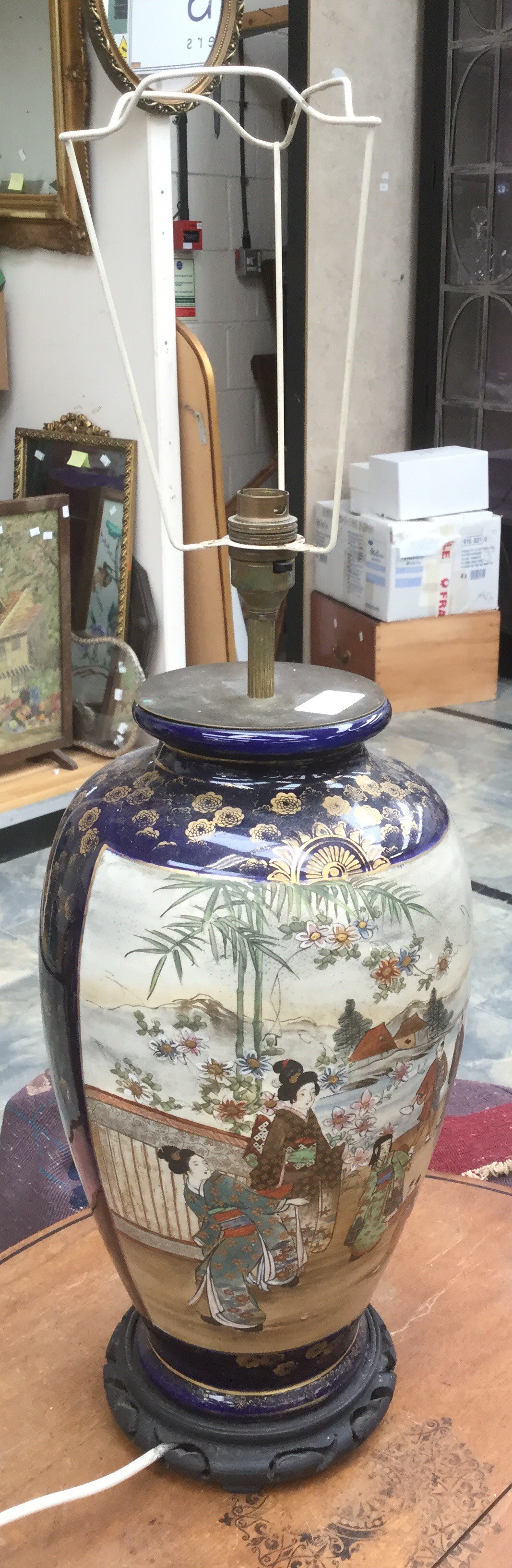 A Japanese Vase converted to a table lamp. On Wooden base. Height of vase approx 40cm.