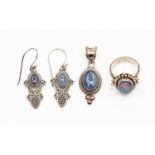 Triplet opals, a black pendant in silver,