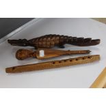 Three African style wooden items including a recorder, crocodile figure,