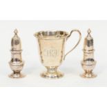 A George V silver christening cup, C-scroll handle on raised foot, the body engraved with initials,