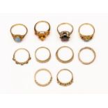 A collection of ten 9ct gold stone set dress rings, including citrine, opal, garnet,