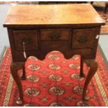 A Queen Anne style walnut lowboy, incorporating earlier timbers,