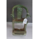 A Chinese Ming Dynasty stylized votive chair, green glaze with hexagonal decoration to the seat,