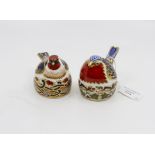 Two Royal Crown Derby paperweights: Goldfinch nesting, gilt badge, date LX and Robin nesting,