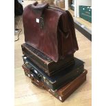 A collection of four various leather and faux leather suit and brief cases (4)