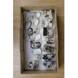 A collection of assorted fairings figures and figural lidded patch boxes,