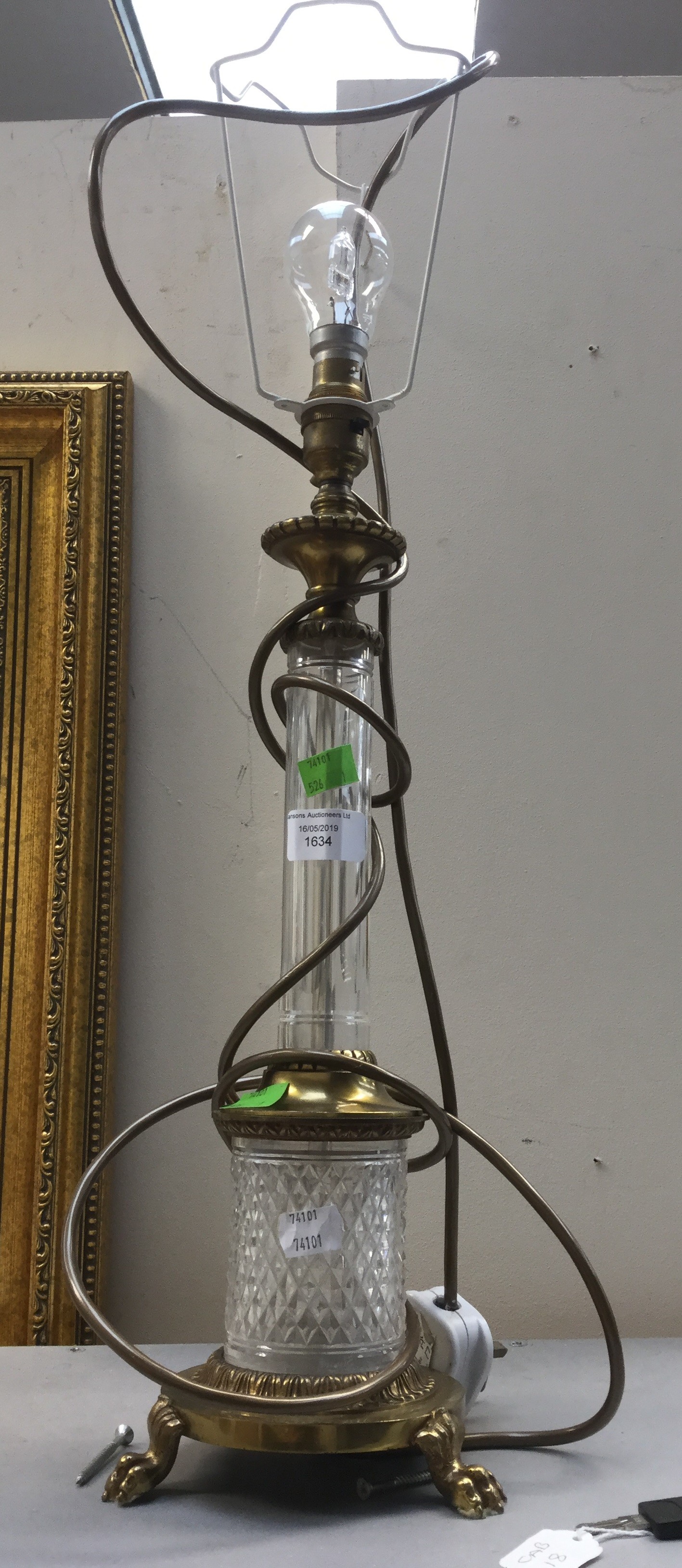 Cut glass and brass table lamp on lions feet Condition: No obvious signs of damage