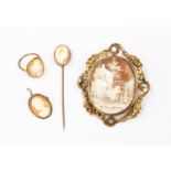 Four items of Victorian gilt metal cameo jewellery comprising a large oval swivel brooch,