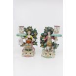 A pair of Samson French Rococo revival figural candlesticks,