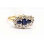 A sapphire and diamond boat shaped cluster ring,