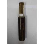 A small four draw 15x brass Telescope with brown leather covering.