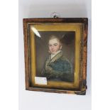 A mid 19th Century portrait miniature on ivory, a young gentleman, half length,