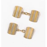 A pair of 18ct gold and platinum cufflinks with engine turned design, rectangular shaped,