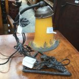 Muller Frere French Art Noveau amber coloured table lamp with triangular shaped wrought iron base