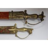 Pair of Indian made decorative Swords: The first has a curved 76cm long fullered single edged blade