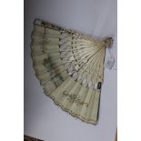 An 18th Century hand-painted and ivory fan, the sticks and guards pierced and gilded,