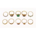 A collection of 9ct gold and stone set dress rings, including a diamond set solitaire,
