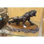A Japanese bronze study of a prowling tiger, Meiji period, 1868-1912, contrasting stripes,