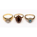 An 18 ct gold ring illusion set with small diamond together with 9 9 ct gold blue zircon and