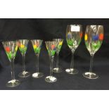 Five hand painted stemmed schnapps glasses together with two hand painted wine glasses,