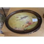 An English porcelain oval plaque painted with fish, seaweed and anemones,