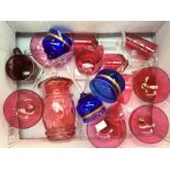 Collection of Cranberry glasses and glassware including champagne cups, lidded bonbon jar,
