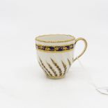 A Derby porcelain 20 pattern coffee cup, circa 1790, wrythen fluting and gilt blue fronds,