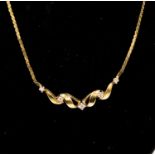 A diamond set 9ct gold necklace, ribbon twist front set with five graduated diamonds, stamped 375,