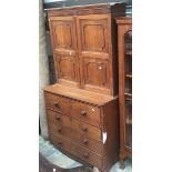 A George III oak secretaire bookcase, the upper section with two doors enclosing fitted shelves,