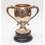 A George V silver two handled trophy, Birmingham 1924, makers mark William Neale Ltd, 28 cms high,