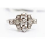 An Art Deco diamond set platinum and white gold ring,